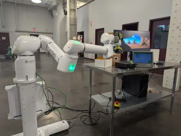 Productive robots arm holding a drill